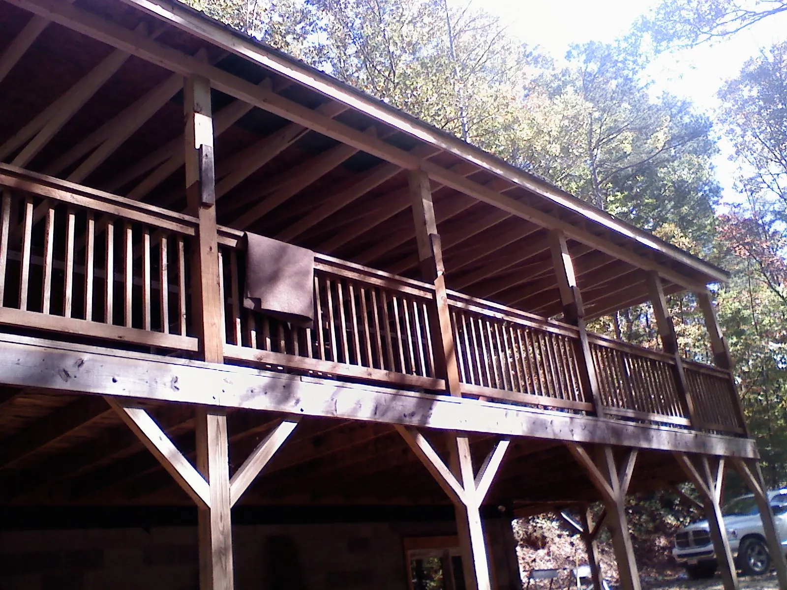 Timber framing under a new elevated porch and deck — Roof Leak Repair in Ontario by Roofing Brothers